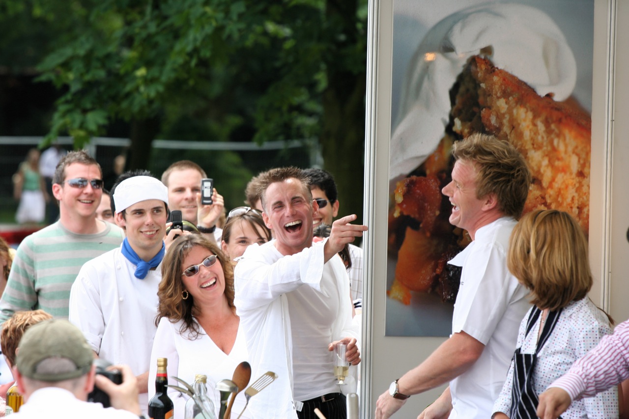 Gary Rhodes surprising Gordon Ramsay at a food festival, photographed by Dave Pullig