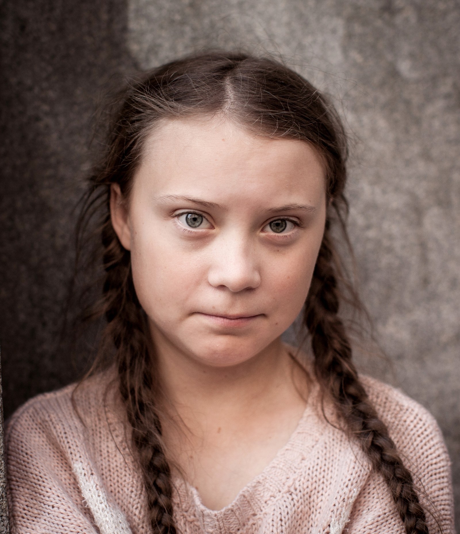 Greta Thunberg with her 'Skolstrejk för klimatet' sign outside parliament in August 2018