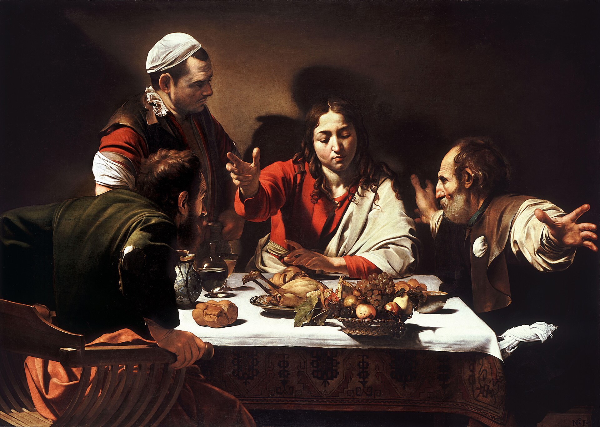 Caravaggio's Supper at Emmaus: the risen Jesus revealed at table as he breaks bread with two disciples
