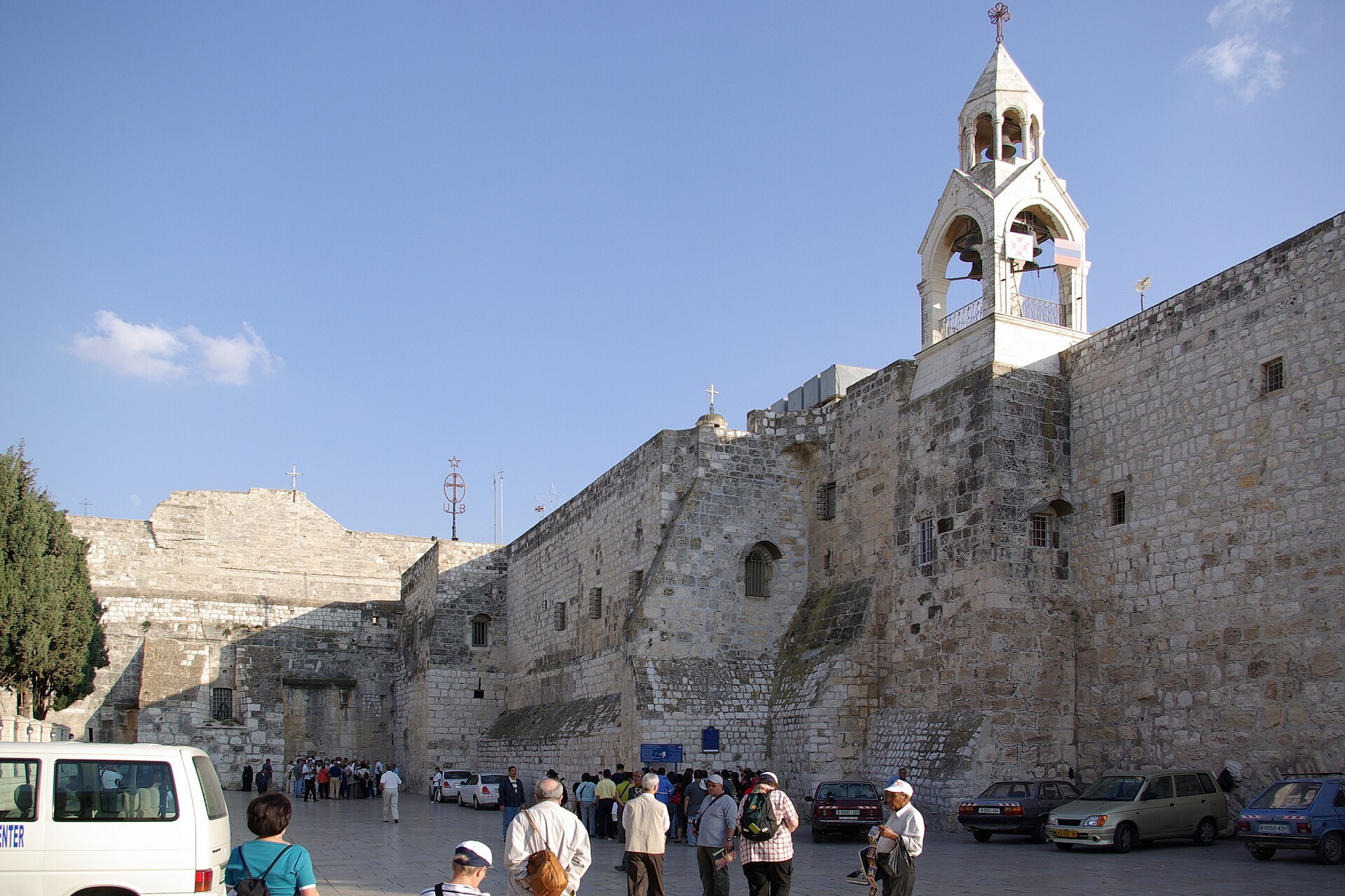 The fortress-like stone facade of the Church of the Nativity in Bethlehem fronting Manger Square