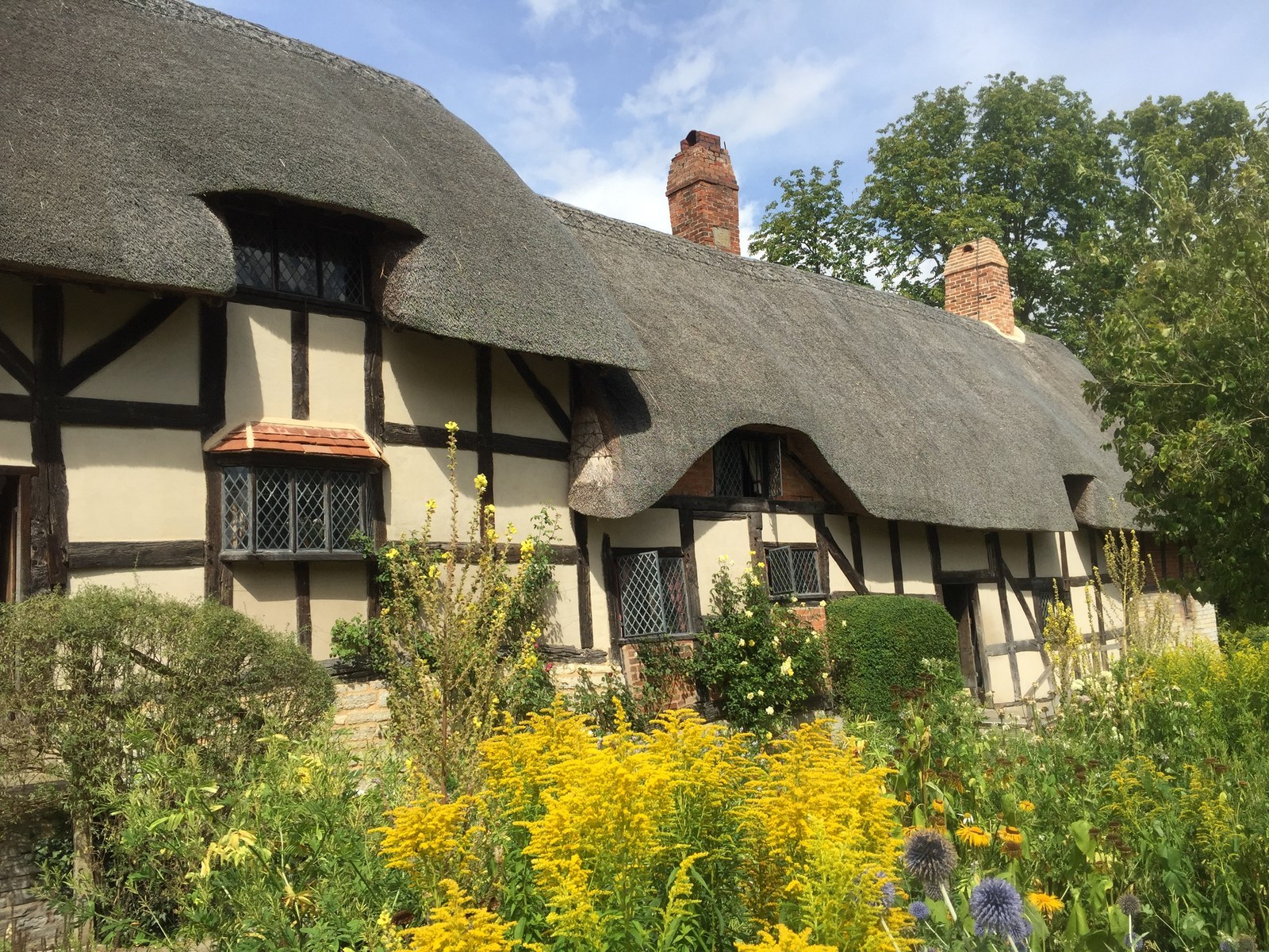 Anne Hathaway's Cottage in Shottery: a thatched twelve-room farmhouse with gardens